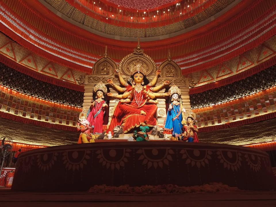 Goddess Durga and accompanying deities inside the decorated pandal