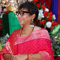 Community member in festive attire during a celebration
