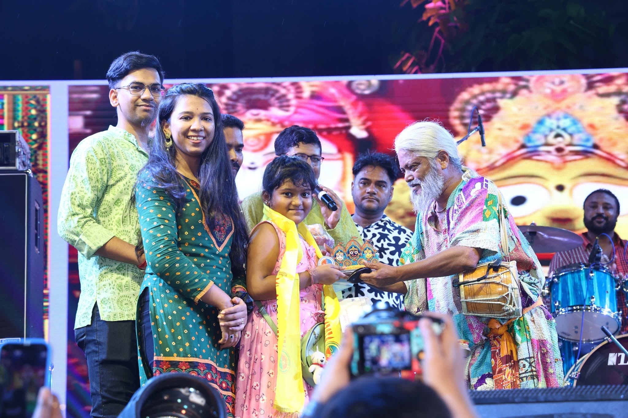 Award distribution ceremony on stage with trophy presentation